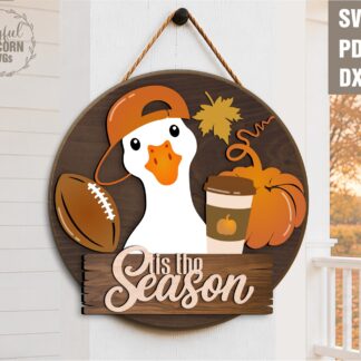 Fall goose door hanger SVG featuring a white goose with a backward cap, football, pumpkin, coffee cup, and Tis the Season sign, laser cut file for Glowforge, CNC machines, and other lasers.