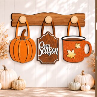 Interchangeable fall wall decor SVG featuring a pumpkin, Cozy Season sign, and autumn coffee mug hanging from wooden hooks on a decorative wooden display bar, laser cut file for Glowforge, CNC machines, and other lasers.