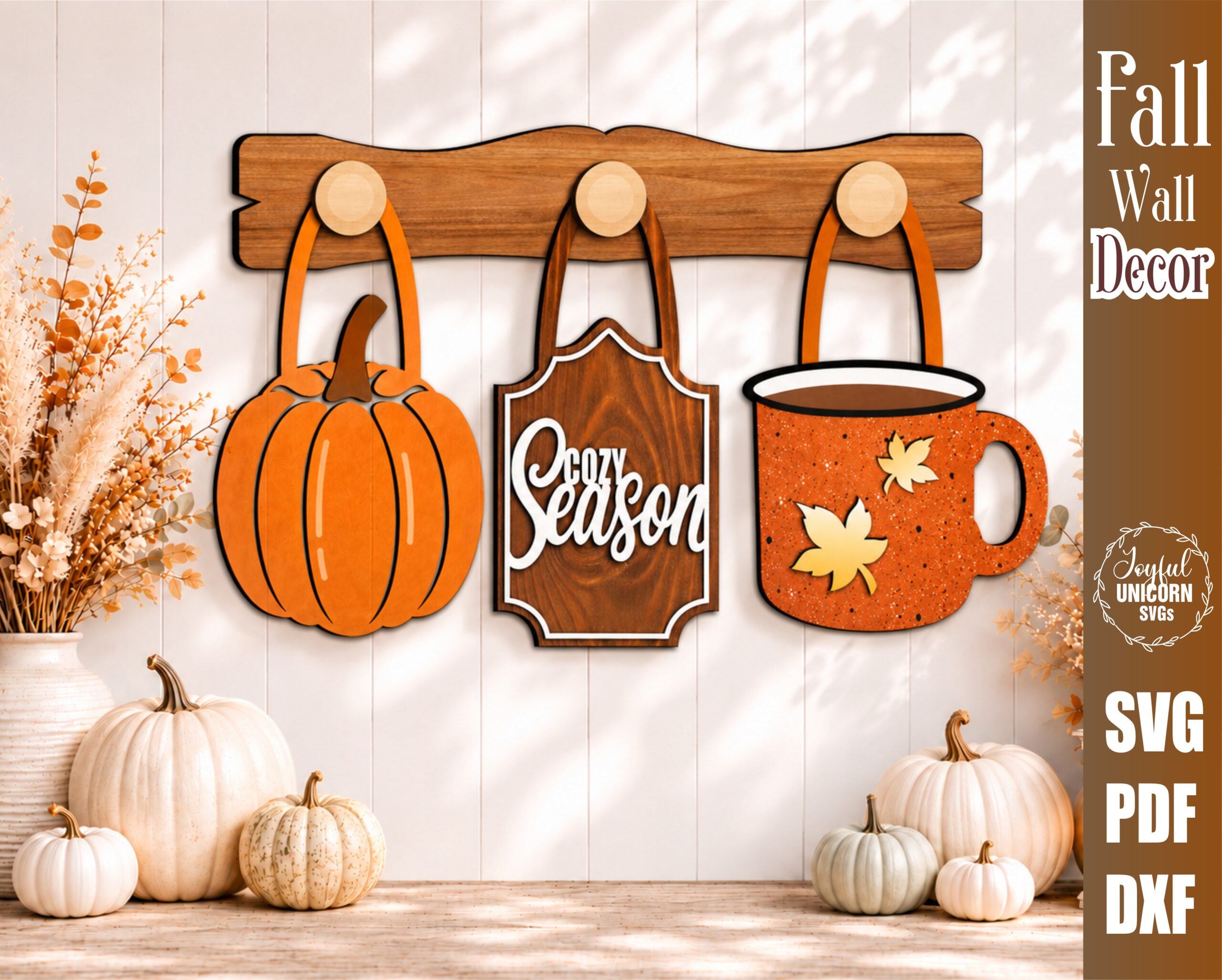 Interchangeable fall wall decor SVG featuring a pumpkin, Cozy Season sign, and autumn coffee mug hanging from wooden hooks on a decorative wooden display bar, laser cut file for Glowforge, CNC machines, and other lasers.