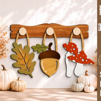 Interchangeable fall wall decor SVG with oak leaf, acorn, and mushroom hanging from wooden hooks on a decorative wooden display bar, laser cut file for Glowforge, CNC machines, and other lasers.